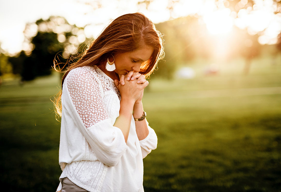Woman Saying Prayer